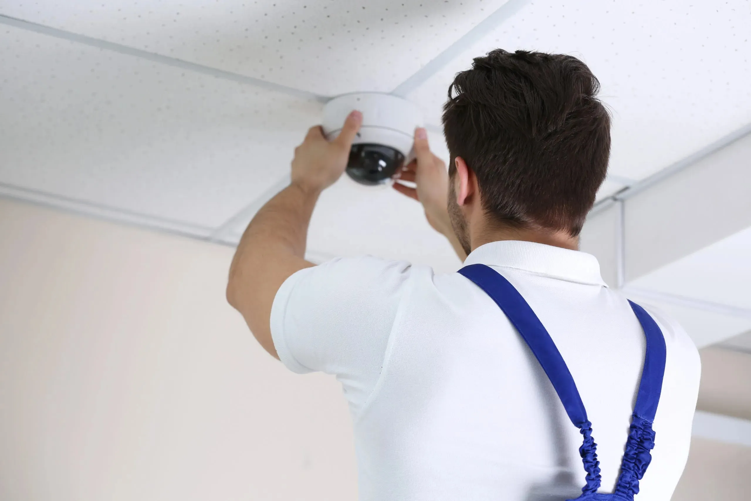 Professional CCTV technician working.