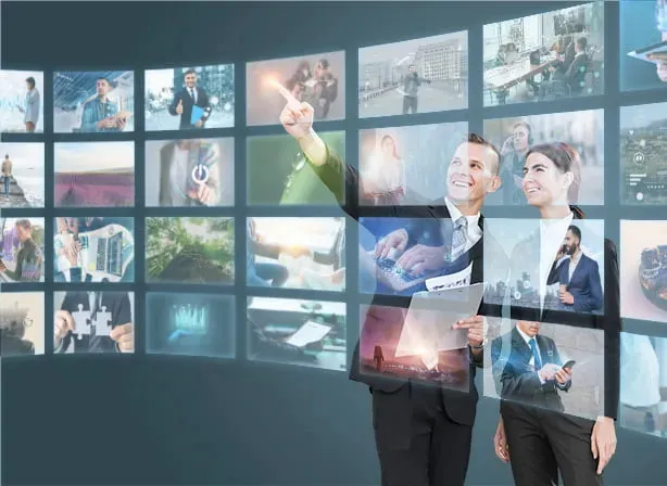 person-working-with-floating-screens Person interacting with advanced Video Wall Solutions displaying multiple screens.